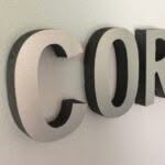 brushed metal sign for business